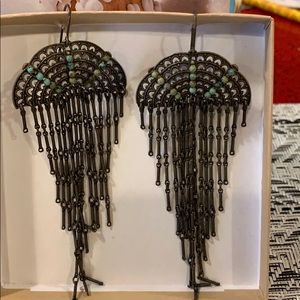 Cascading earrings with inset turquoise stone